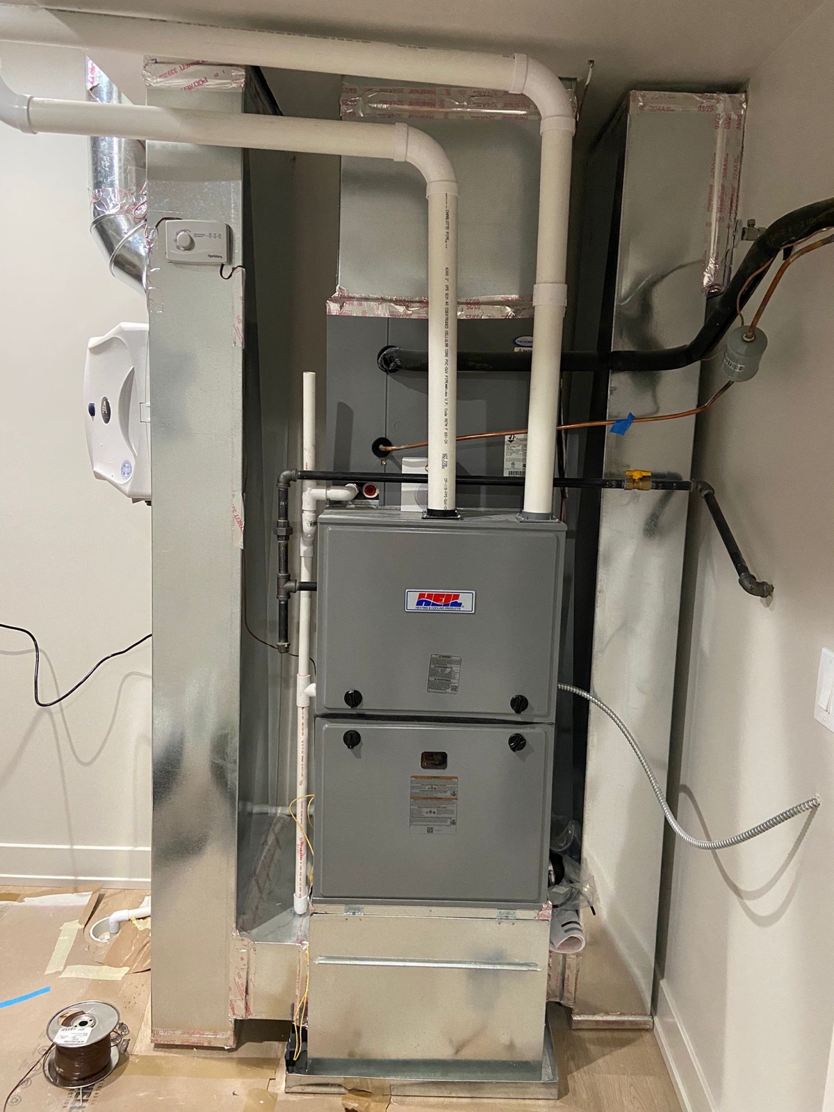 High-efficiency furnace with sealed PVC venting